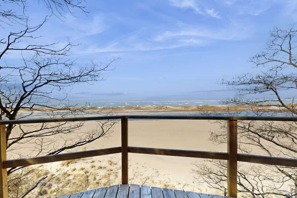 Spacious lakefront home with panoramic views and private beach