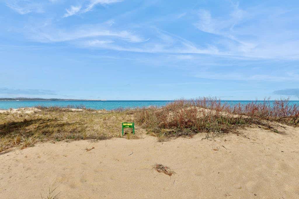 Desirable beachfront condo in Glen Arbor with patio, fireplace, kitchenette & AC