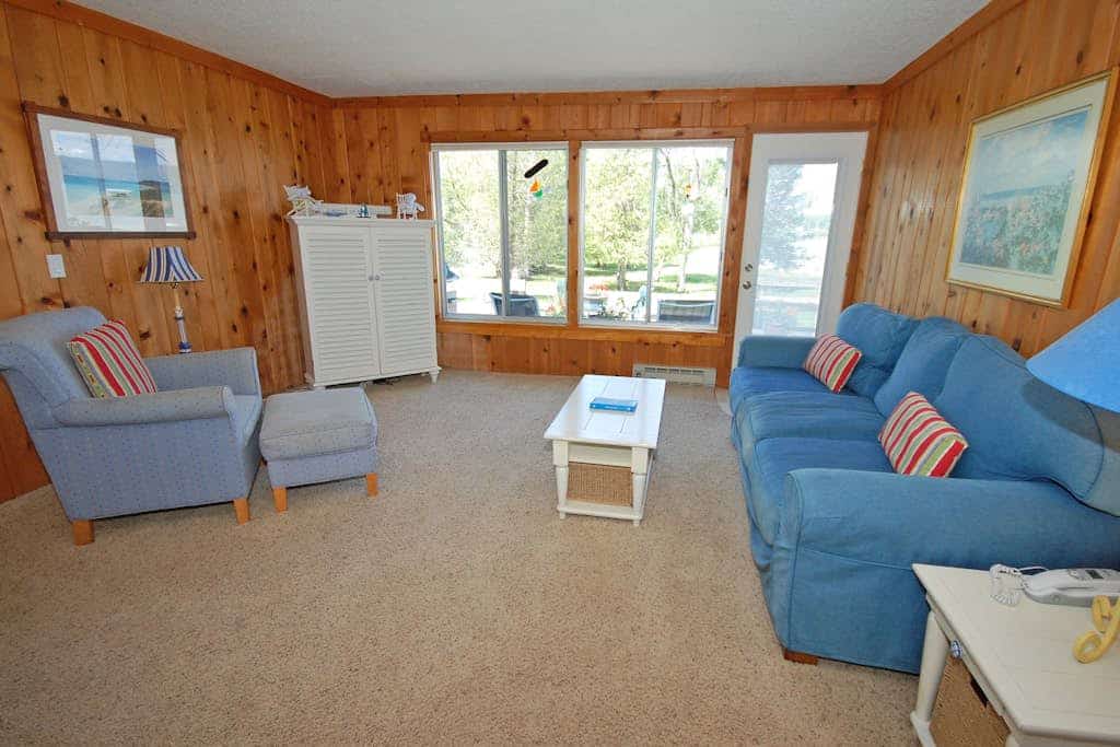 Lakefront cottage with a deck, grill, firepit, dock & partial AC
