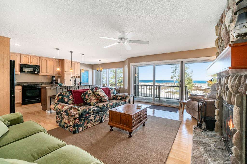 Lakefront condo with deck, gorgeous view, fireplace, & W/D
