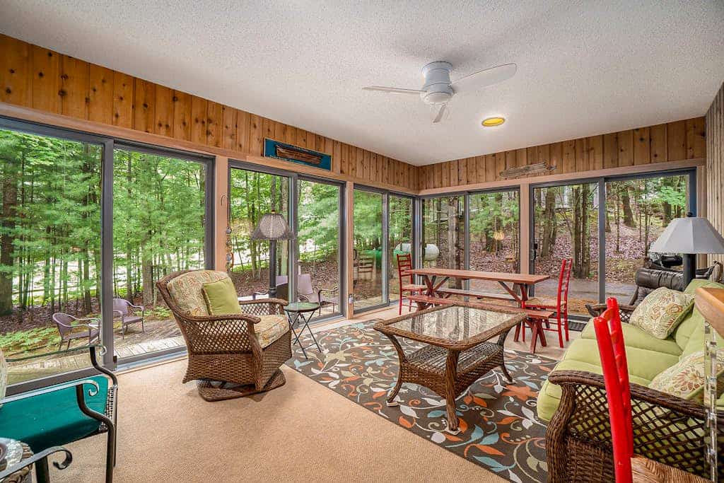 Two-story home with a patio, sunroom, balcony, & washer/dryer access