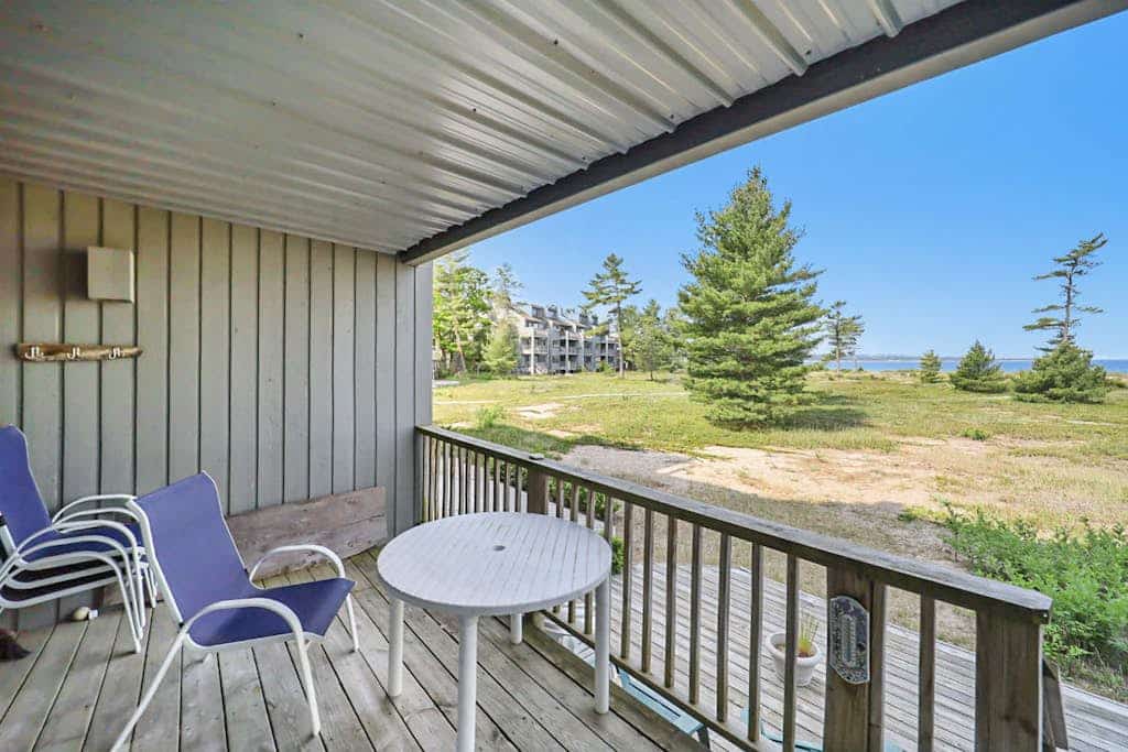 Lower-level beachfront condo with deck, lake views, washer/dryer, fireplace