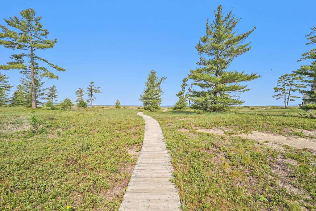 Lower-level beachfront condo with deck, lake views, washer/dryer, fireplace