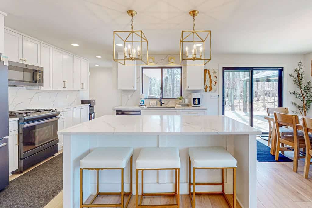 Modern Home in the woods w/ a large patio, gas grill, & near the lake