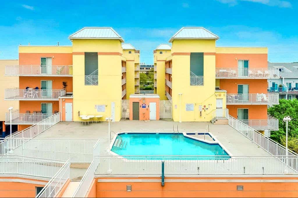 Midtown OC Getaway • Balcony Views • Pool + Dock • 1 Block to the Beach