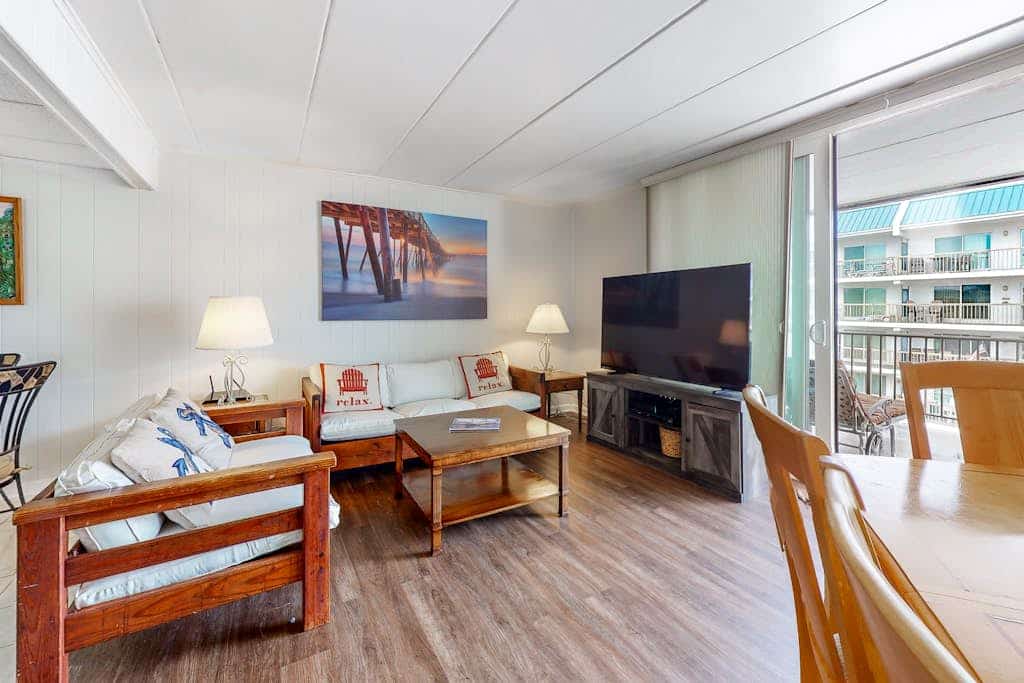 3rd-floor condo near the beach with balcony, partial ocean views, & central AC