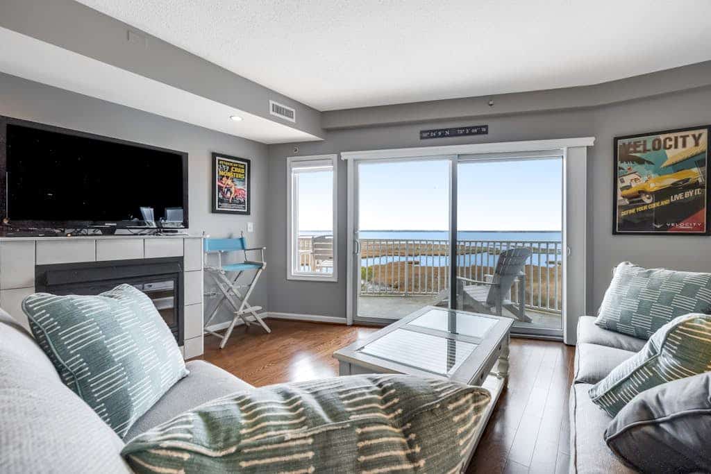 3rd-floor condo w/bay views, private balcony, free WiFi, W/D, and near the beach