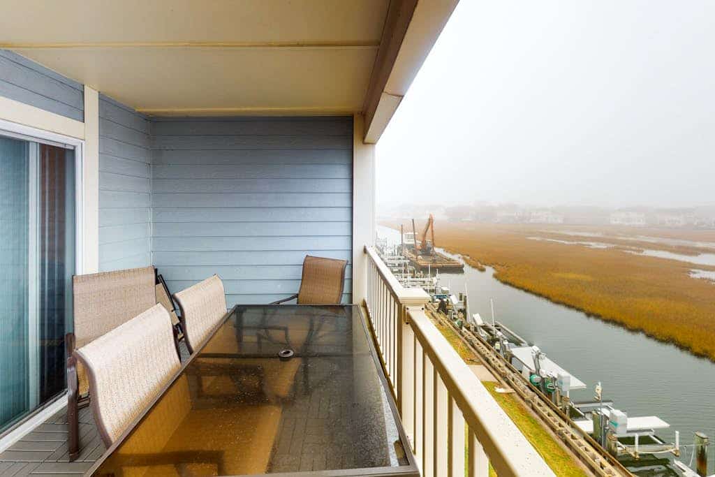 Sunny condo w/balcony, water views, shared outdoor pool + kiddie pool
