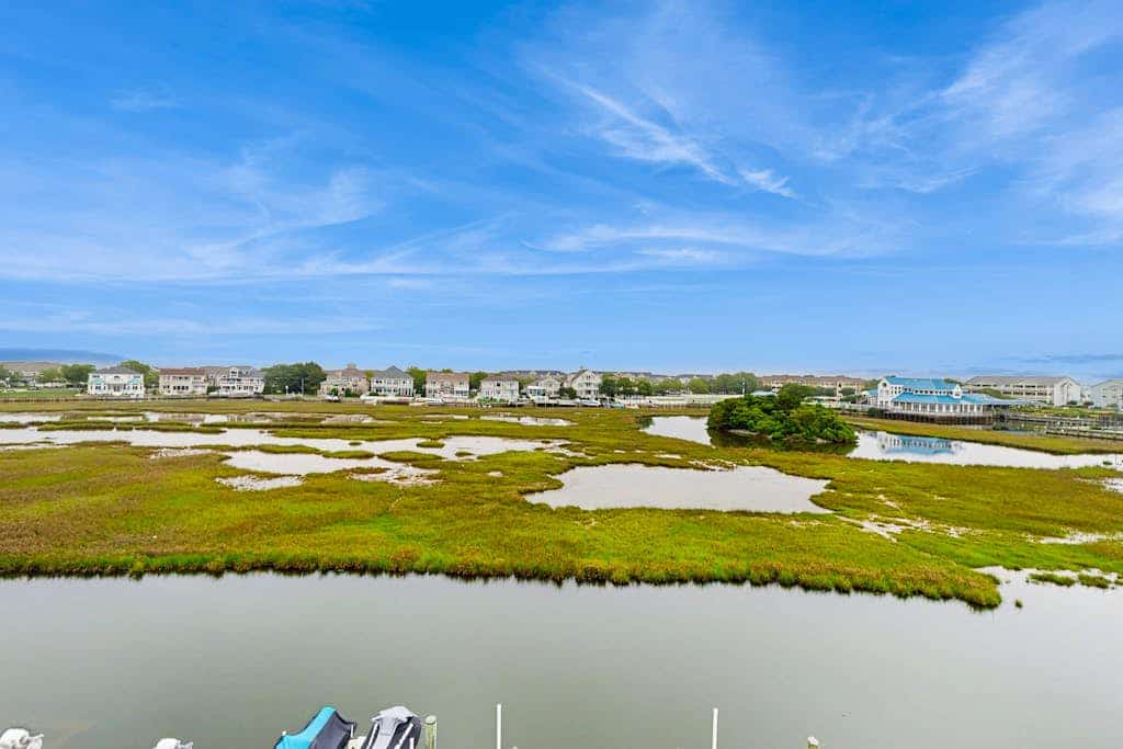Family-friendly condo with beach access, pools, covered deck, W/D & AC