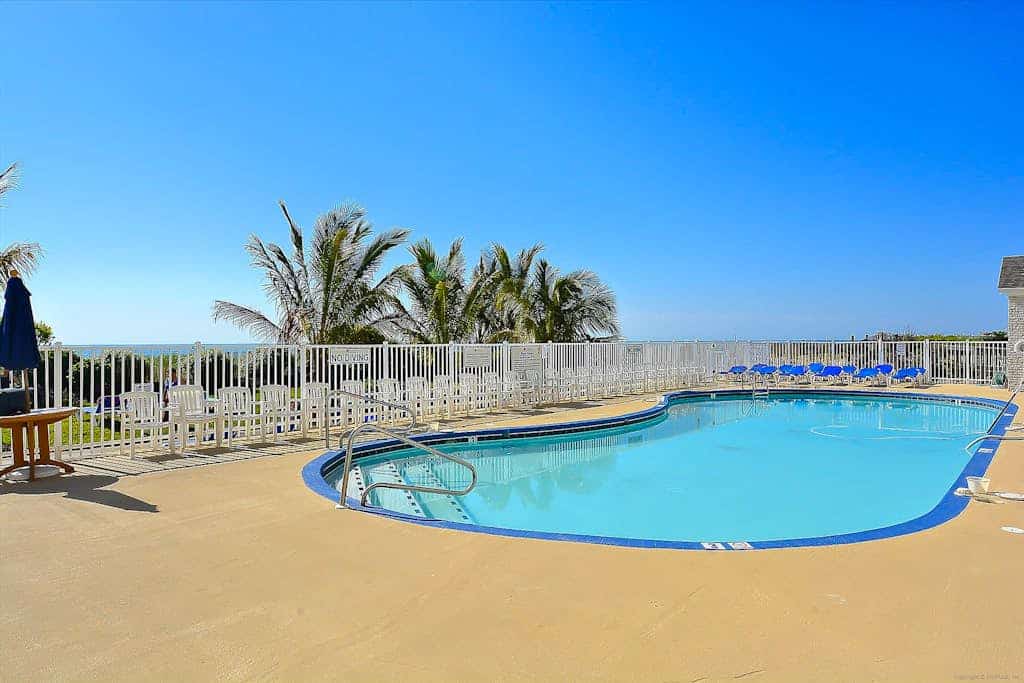 Beachfront condo with balcony, pools, sauna, gym, & game room