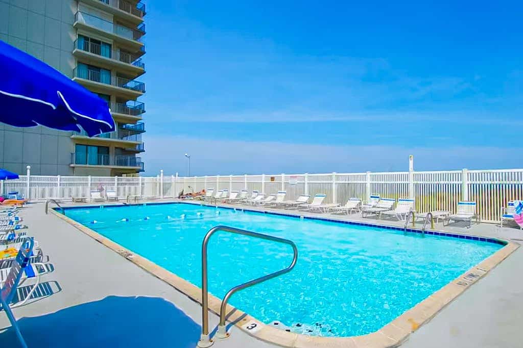 Renovated oceanfront home with sunrise views, large balcony, pool & beach access