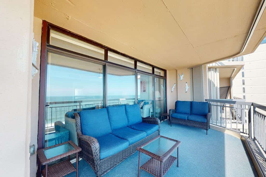 Beachfront condo with outdoor pool, bay & sunset views, large balcony, & tennis