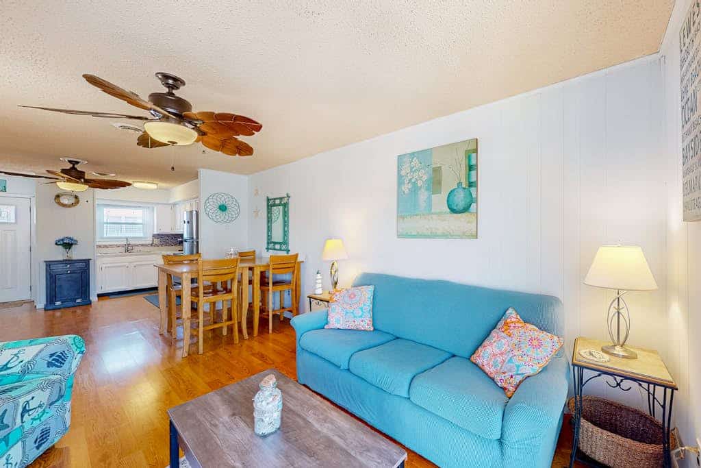 Water view condo with peaceful balcony, open layout, smart TVs, games, & W/D