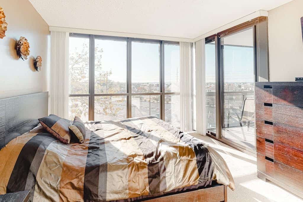 Light-filled beach condo with balcony, AC, angled views, pools, gym & sauna
