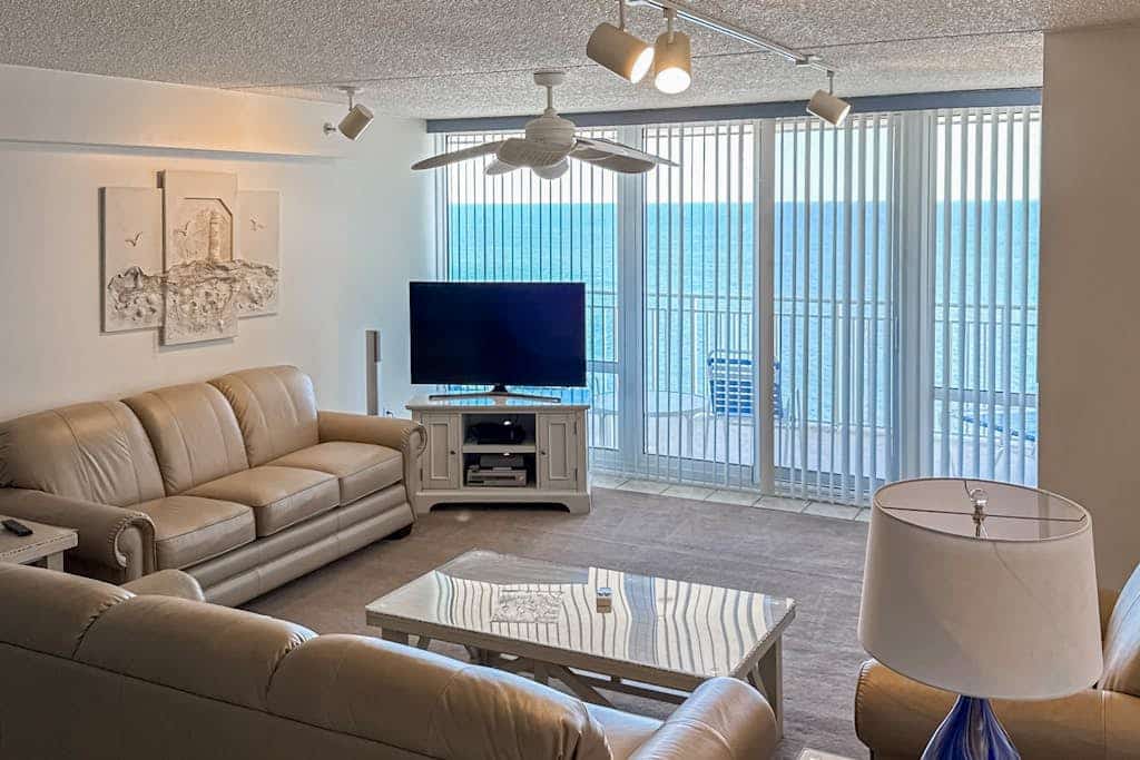 Recently updated beachfront condo with balcony, AC, pools, sauna, & game room
