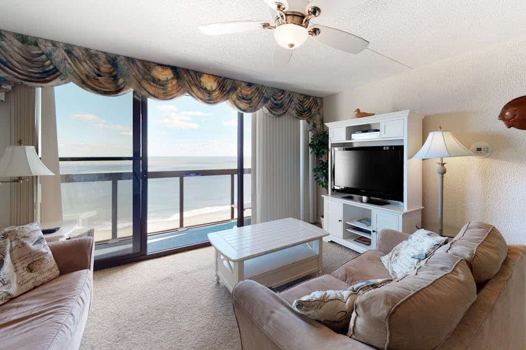 Affordable beachfront condo with balcony, W/D & pools