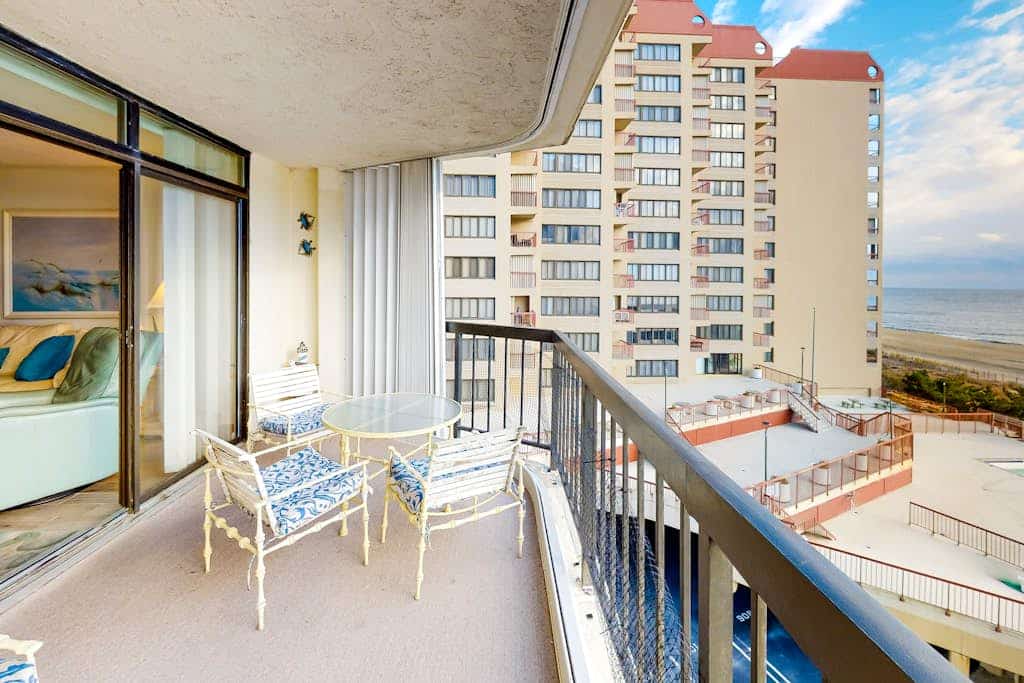 Oceanfront corner condo with spacious balcony, game room & W/D