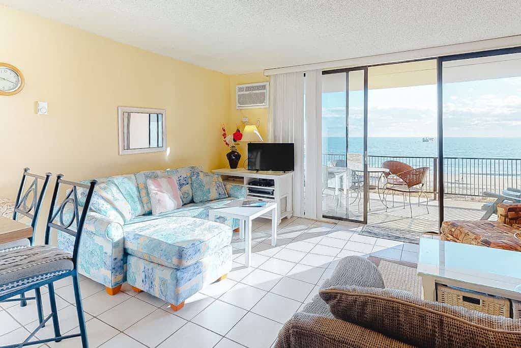 Oceanfront condo with pool, AC, balcony, & washer/dryer