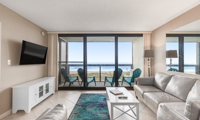 Convenient beachfront condo with views, balcony, pools, gym & game room