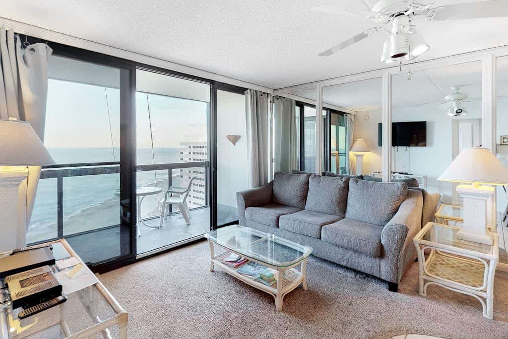 Beachfront condo with balcony, AC, pools, gym & sauna