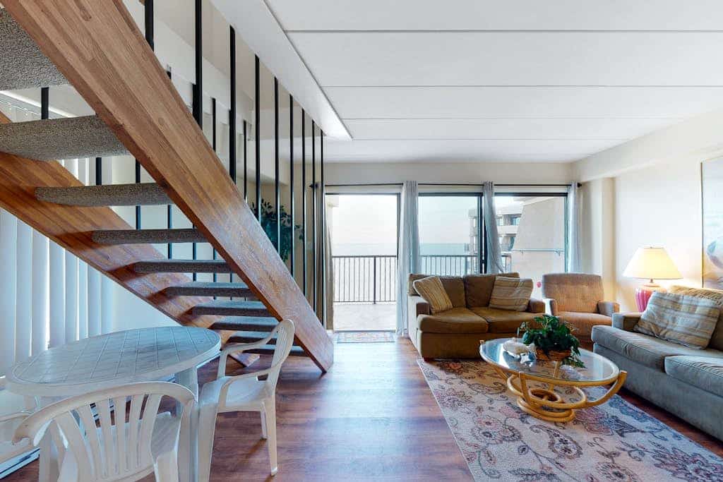 Two-story penthouse condo with spacious balcony, pool, & incredible views
