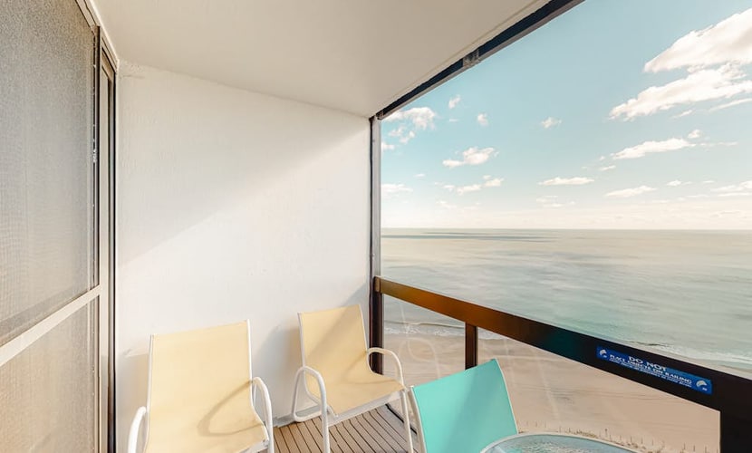 Updated oceanfront condo with ample balcony, AC, pools, gym & sauna