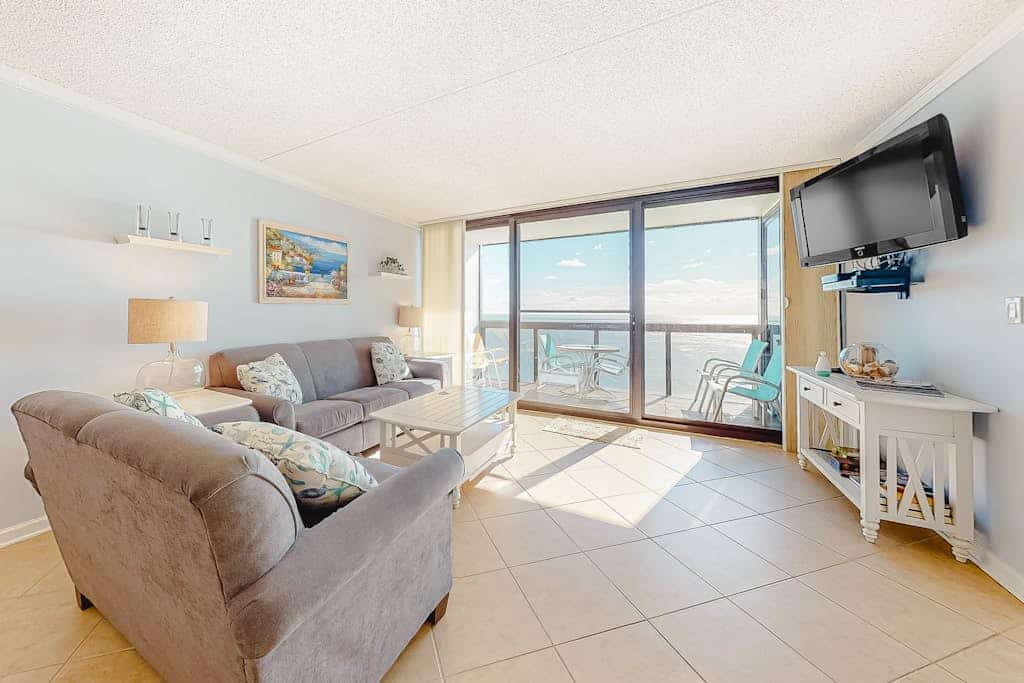 Updated oceanfront condo with ample balcony, AC, pools, gym & sauna