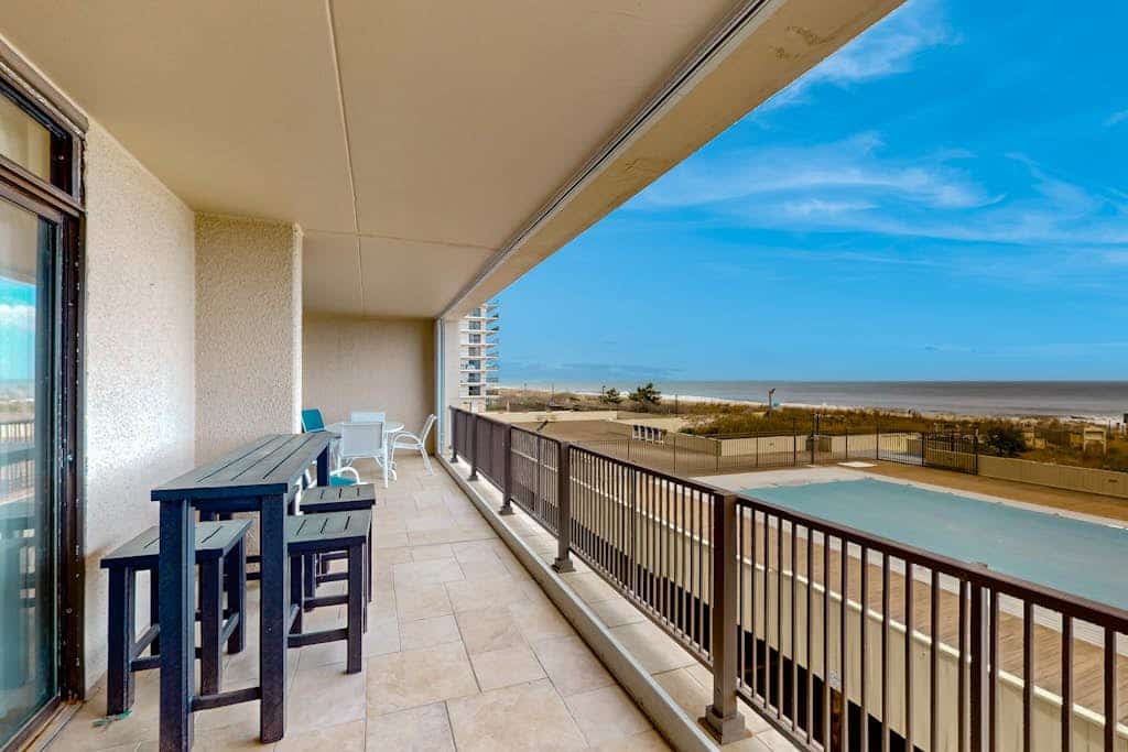 Exquisite beachfront condo with pool & beach views & balcony