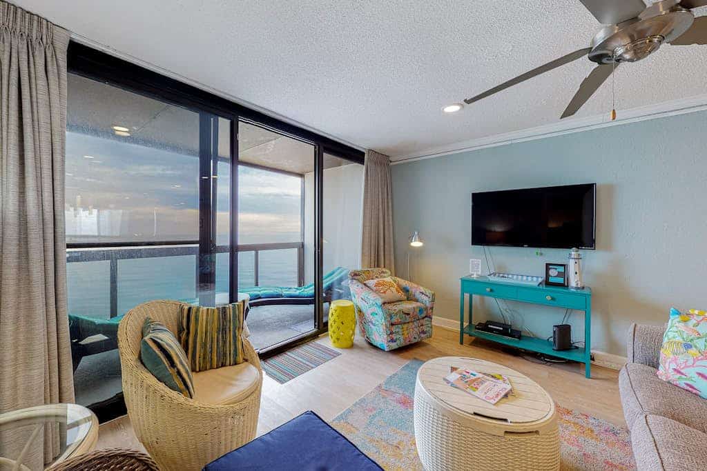 Updated waterfront condo with balcony, pools, game room, sauna & gym