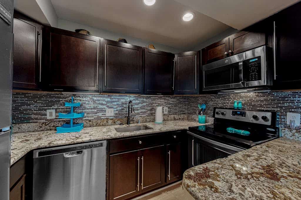Updated waterfront condo with balcony, pools, game room, sauna & gym