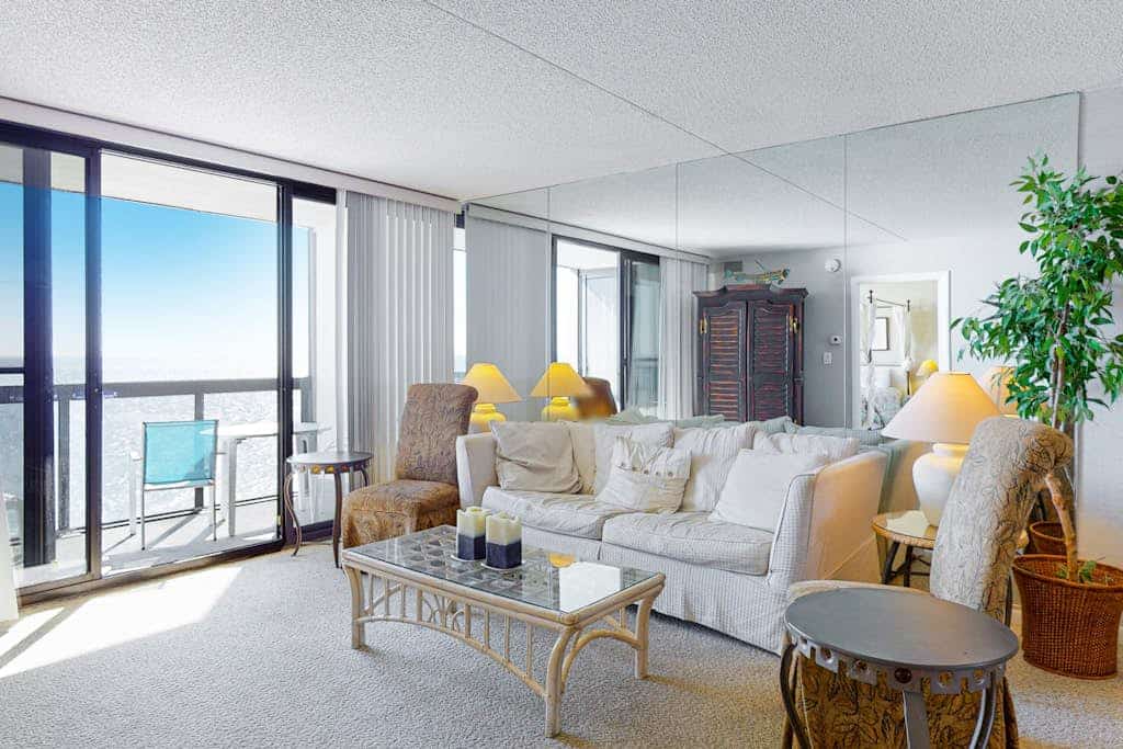 Incredible waterfront condo with furnished balcony, beach views, pools & gym