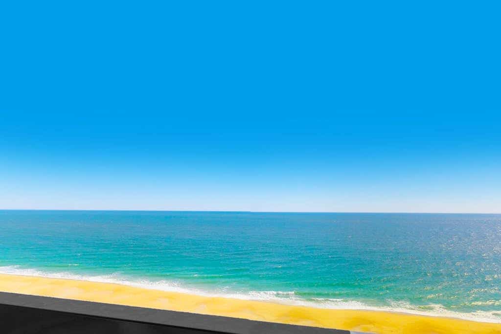 Incredible waterfront condo with furnished balcony, beach views, pools & gym