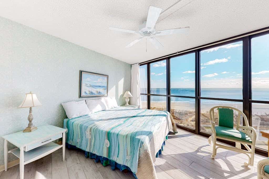 Unparalleled beachfront condo with balcony, pools, game room, gym & sauna