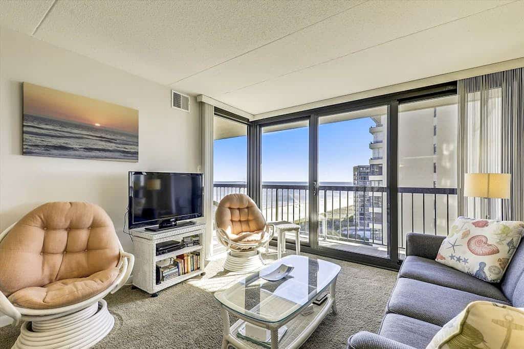Beachfront condo with balcony, game room, pools, sauna & gym