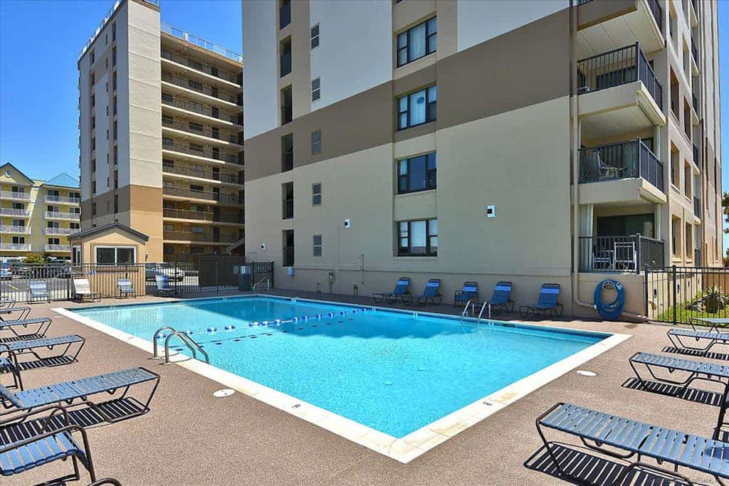 Delightful beachfront condo with balcony, sweeping views, pool, W/D & central AC