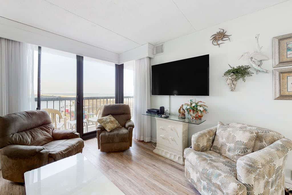 Beach condo with water & tennis court views, balcony, pools & sauna