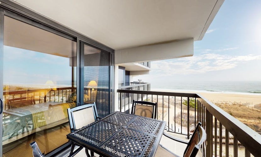 Spacious beach condo with balcony, beach views, pools, gym & AC