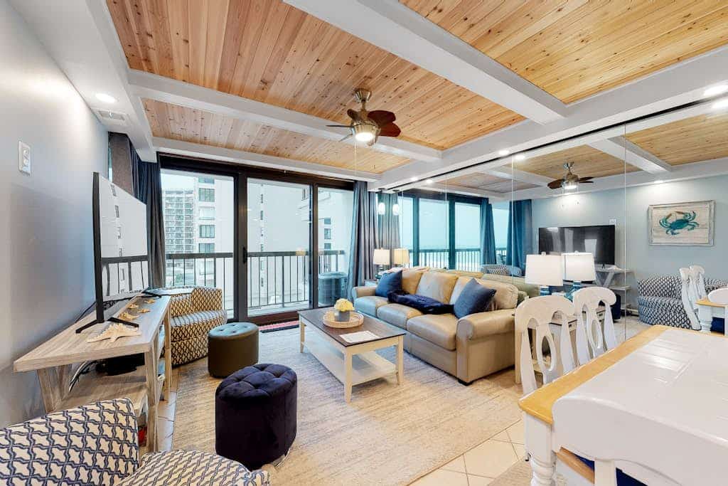 Spacious beach condo with balcony, beach views, pools, gym & AC