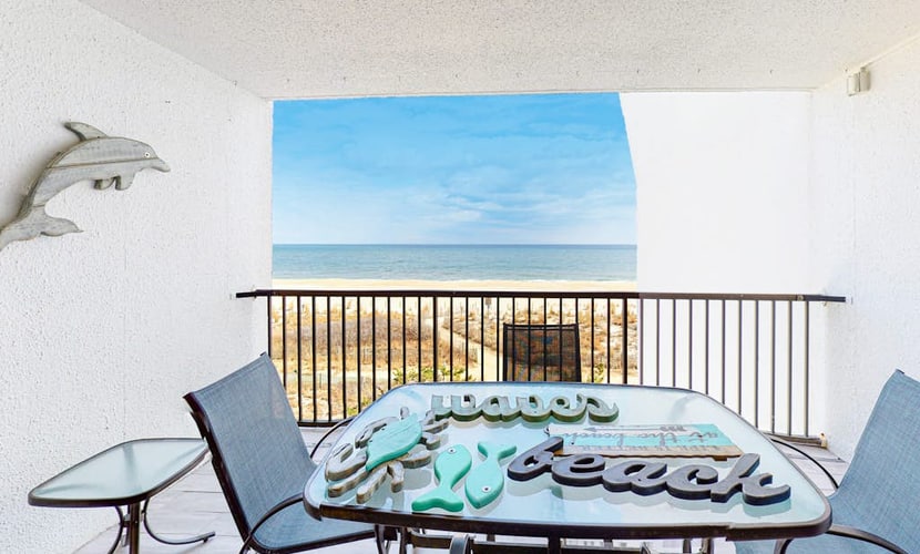 Oceanfront Condo with Shaded Balcony, WiFi, Laundry, AC & Shared Pool