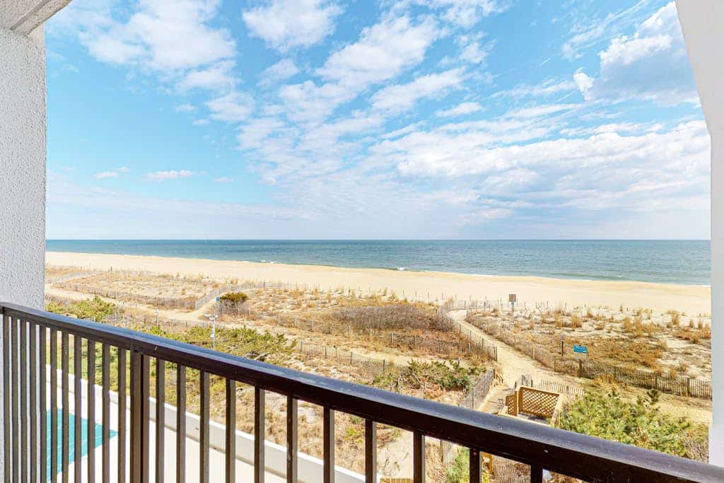 Oceanfront Condo with Shaded Balcony, WiFi, Laundry, AC & Shared Pool