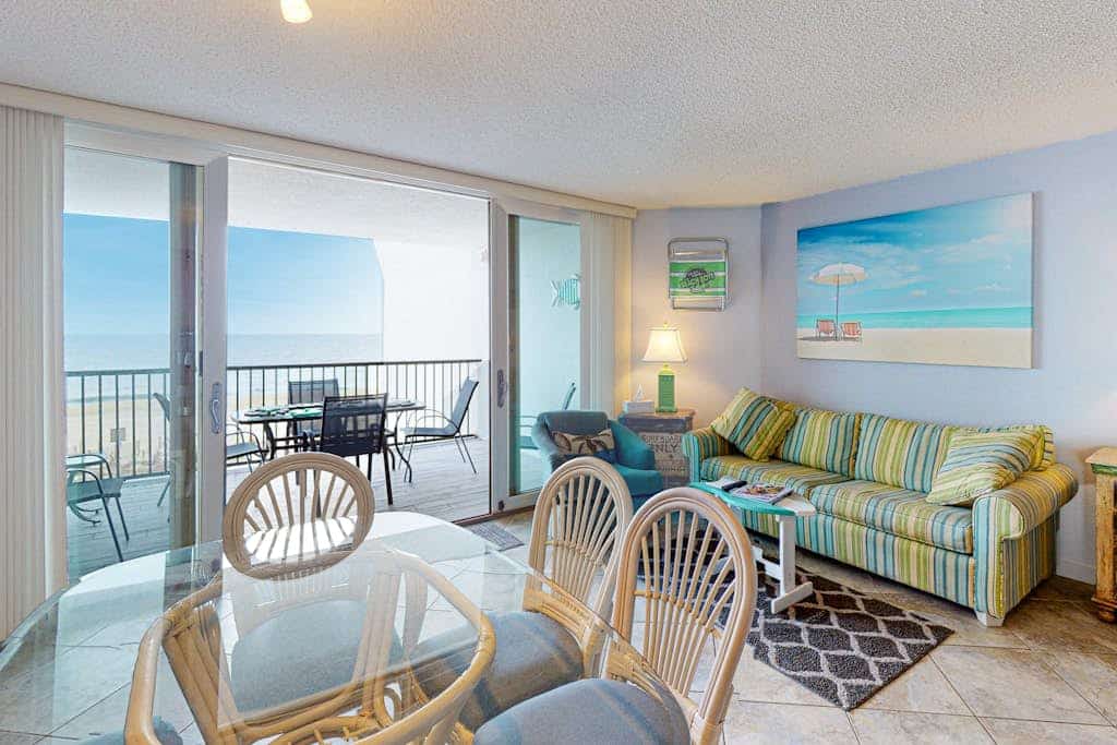Oceanfront Condo with Shaded Balcony, WiFi, Laundry, AC & Shared Pool