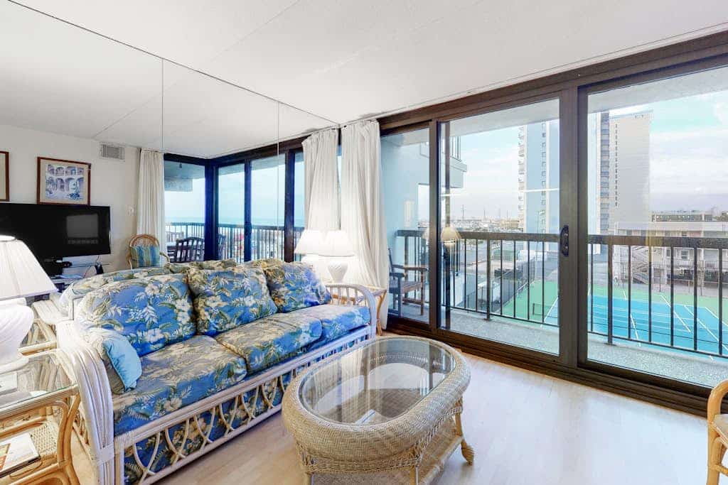 Sunny, inviting condo near the beach with balcony, pools & gym