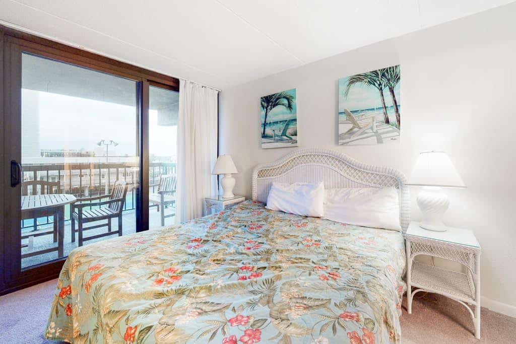 Sunny, inviting condo near the beach with balcony, pools & gym