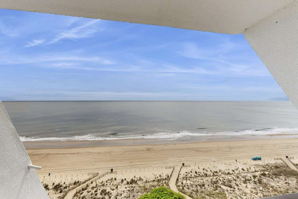 Oceanfront Condo with a Shaded Balcony, AC, WiFi, Laundry & Shared Pool