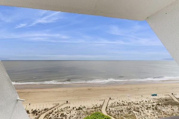 Oceanfront Condo with a Shaded Balcony, AC, WiFi, Laundry & Shared Pool