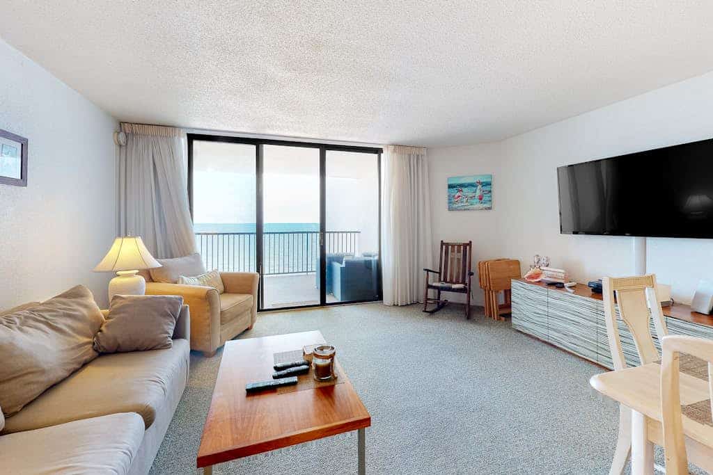 Oceanfront condo with ocean view, private W/D, central AC, and pool access