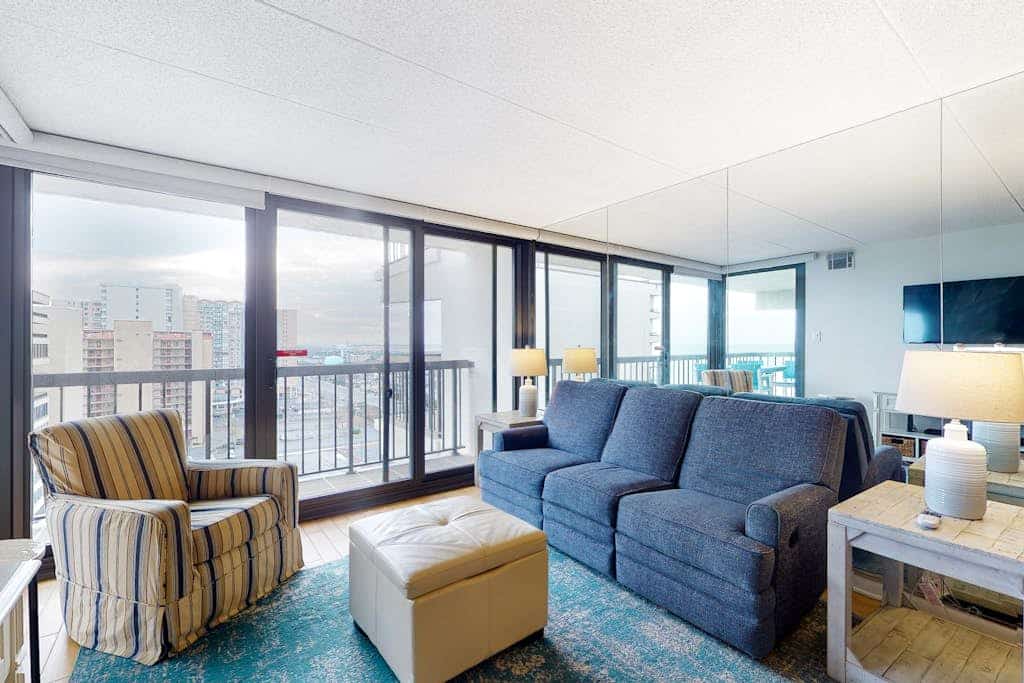 Beachfront corner condo with balcony, views, pools, game room, gym & sauna