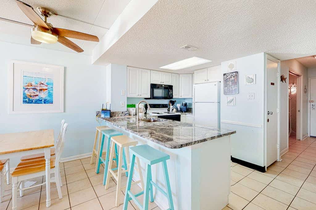 Stunning beach condo with balcony, views, pools, gym, game room & sauna