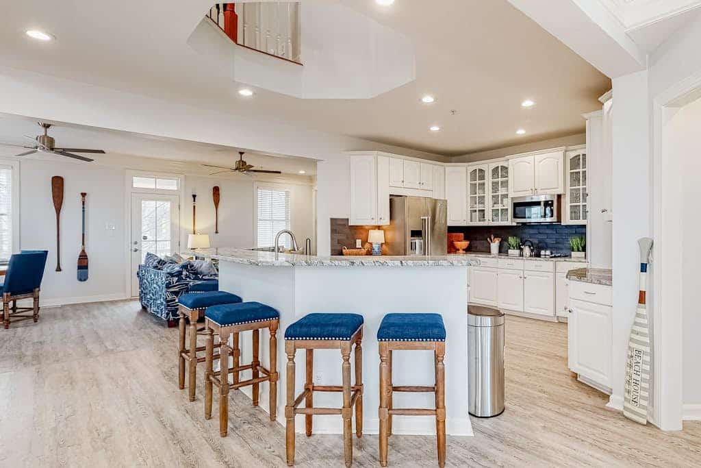 Spacious beachside home with fireplace, washer/dryer, pools, dock, & gym