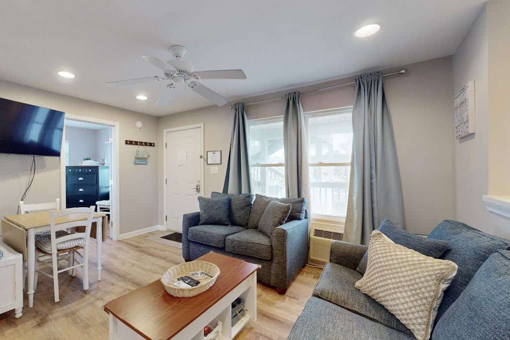 Coastal condo with a scenic balcony, central location, washer/dryer, games, & AC